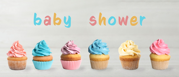 Image of Delicious cupcakes for baby shower party on light table, banner design