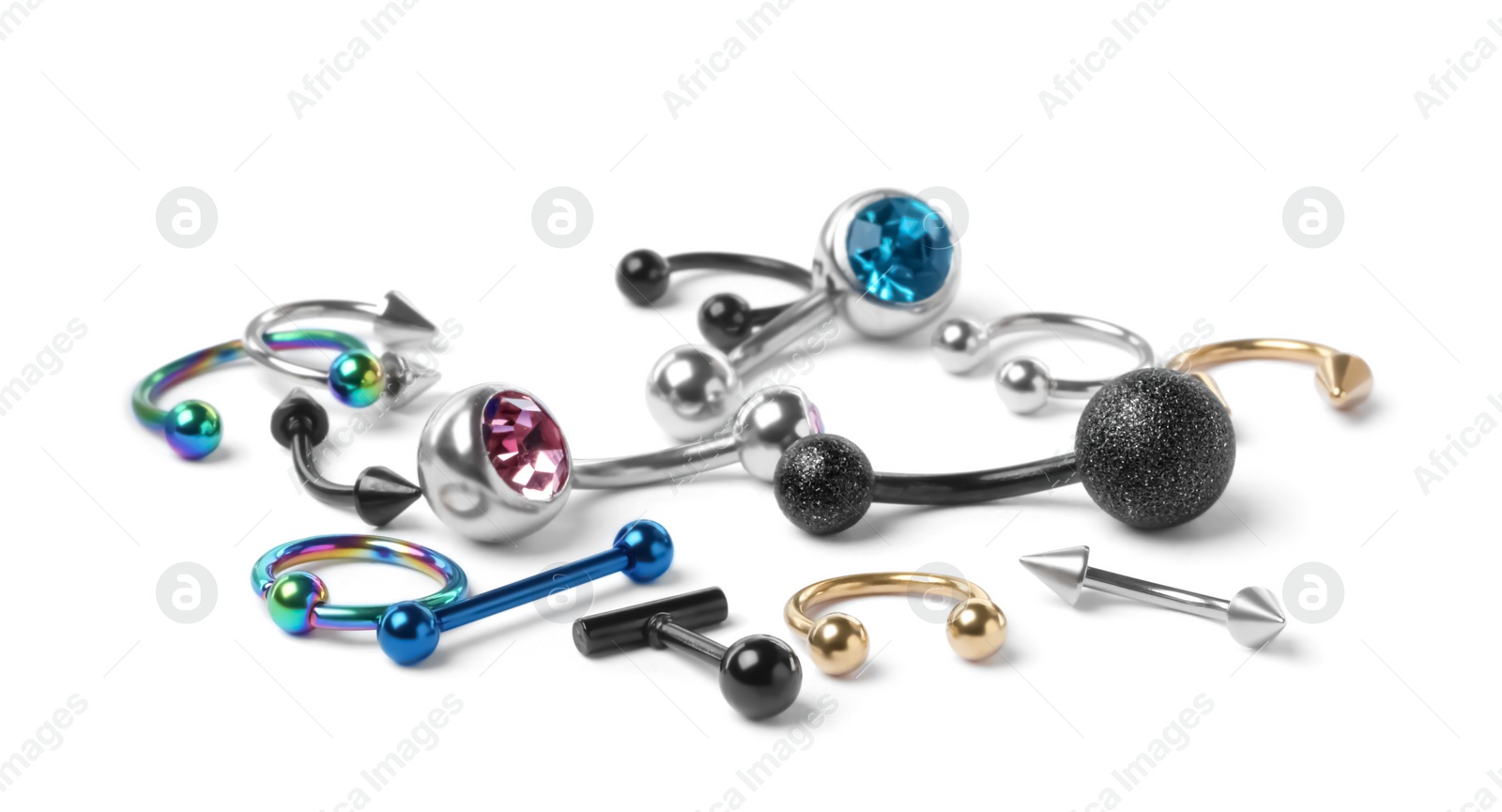 Photo of Different stylish piercing jewelry on white background