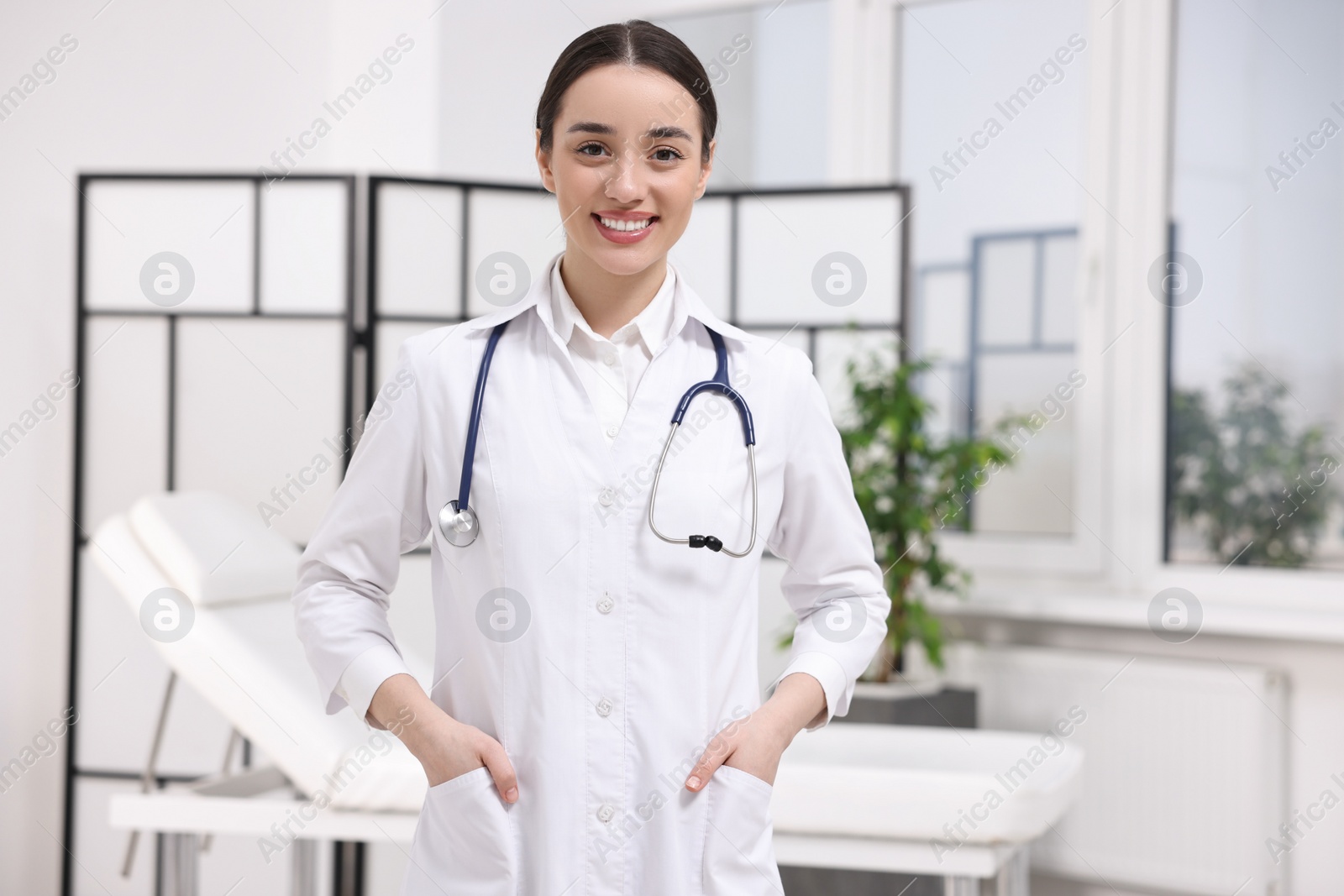 Photo of Portrait of medical consultant with stethoscope in clinic