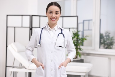 Photo of Portrait of medical consultant with stethoscope in clinic