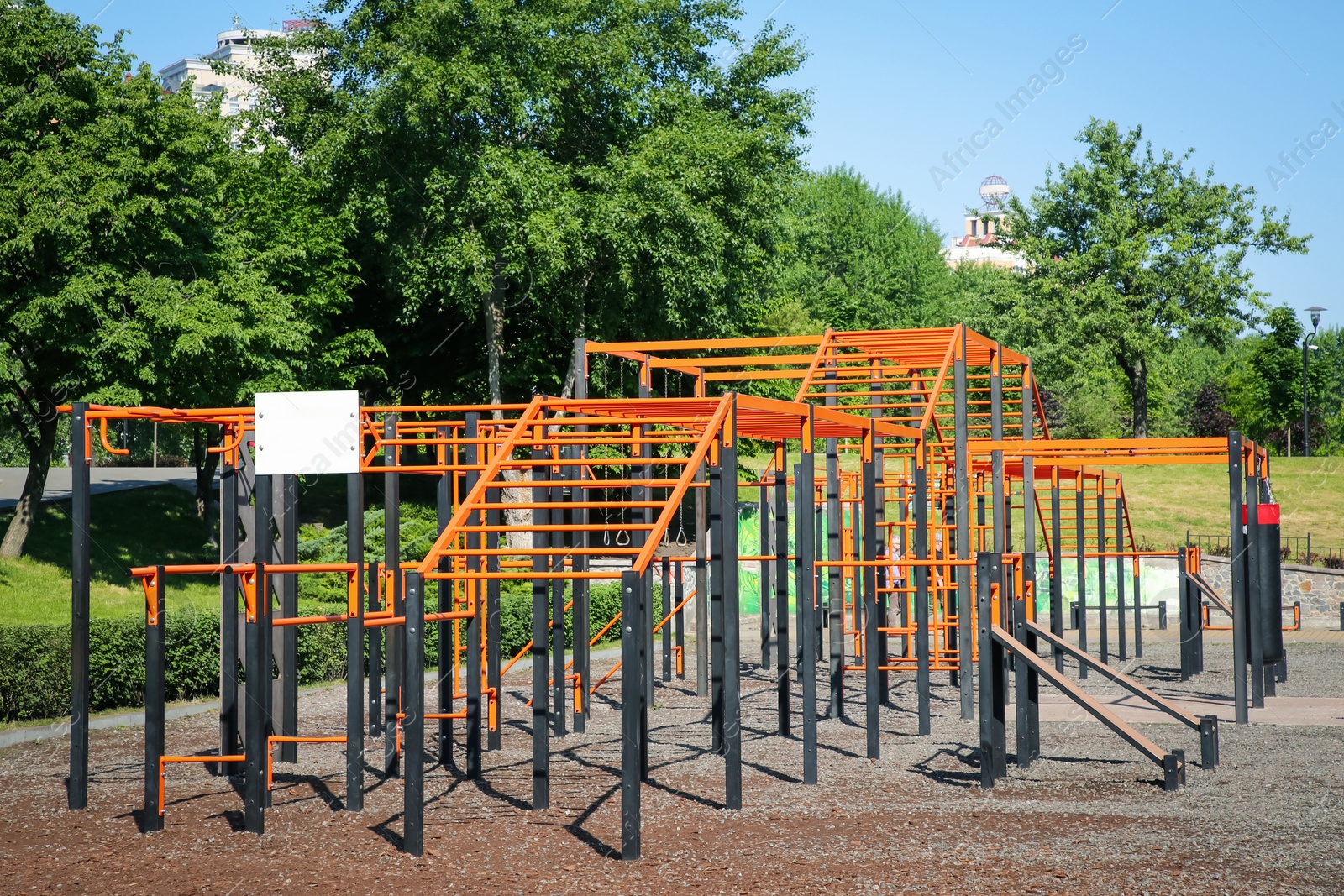 Photo of Empty outdoor gym with exercise equipment in park