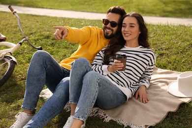 Photo of Beautiful young couple spending time together outdoors