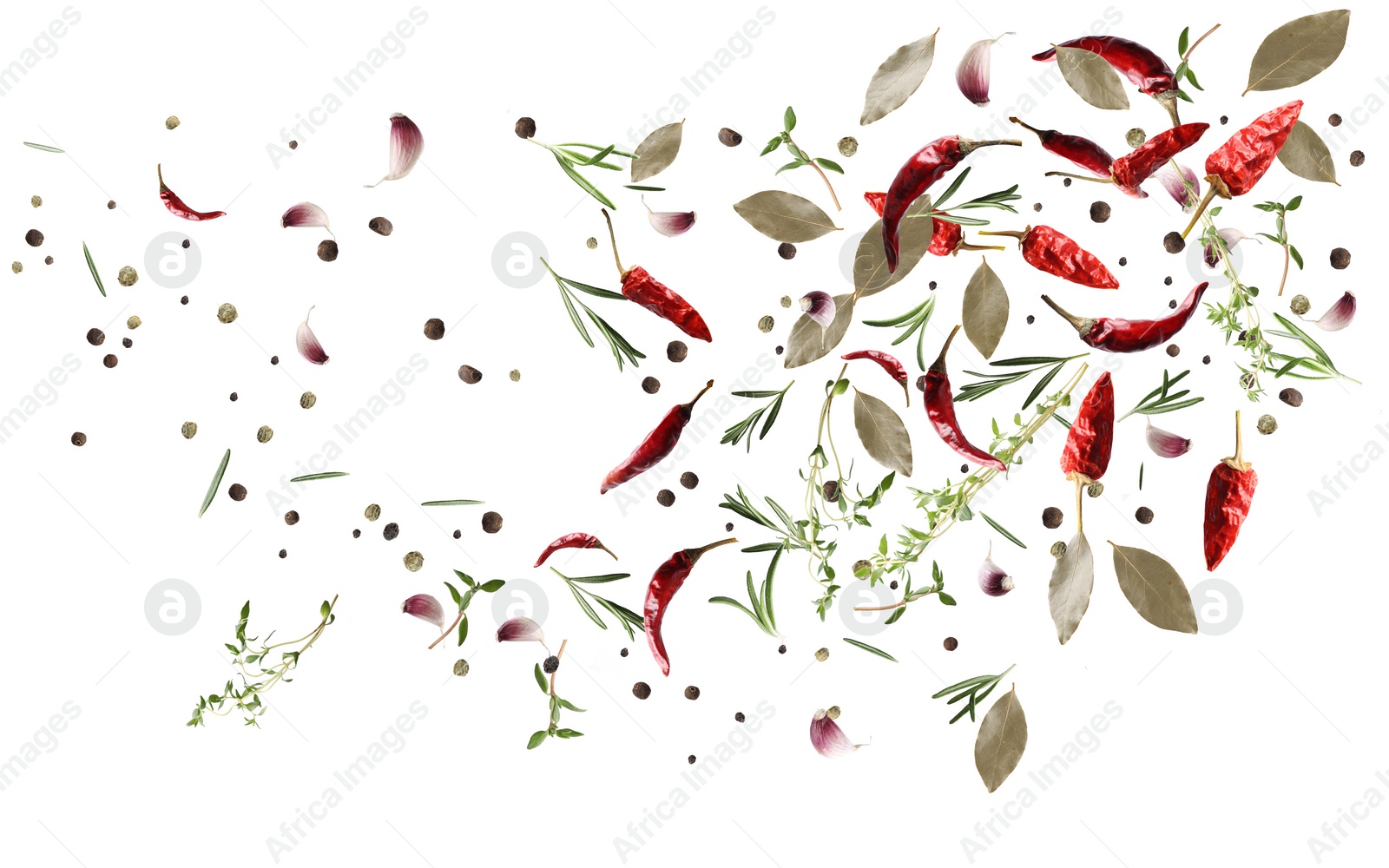 Image of Many different spices flying on white background