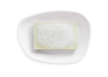 Soap bar with fluffy foam in holder on white background, top view