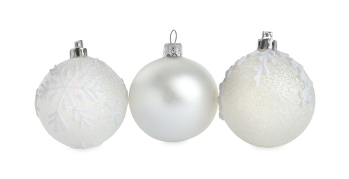 Photo of Beautiful shiny Christmas balls on white background