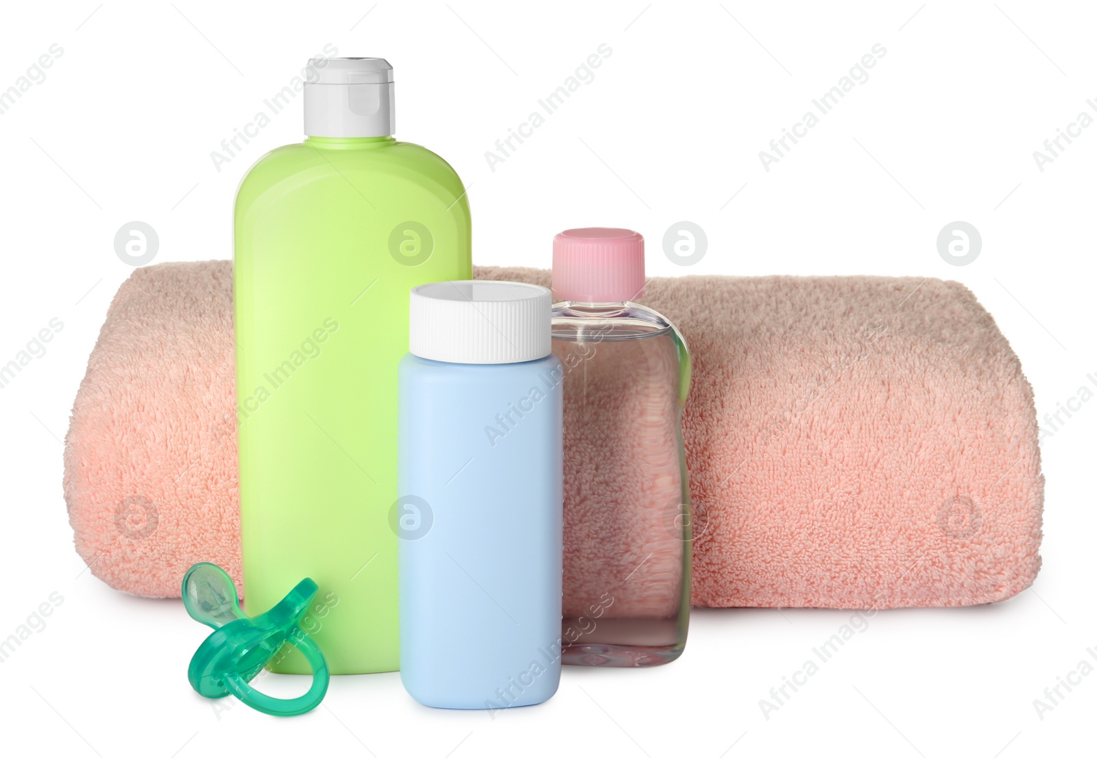Photo of Bottles of baby cosmetic products, towel and pacifier on white background