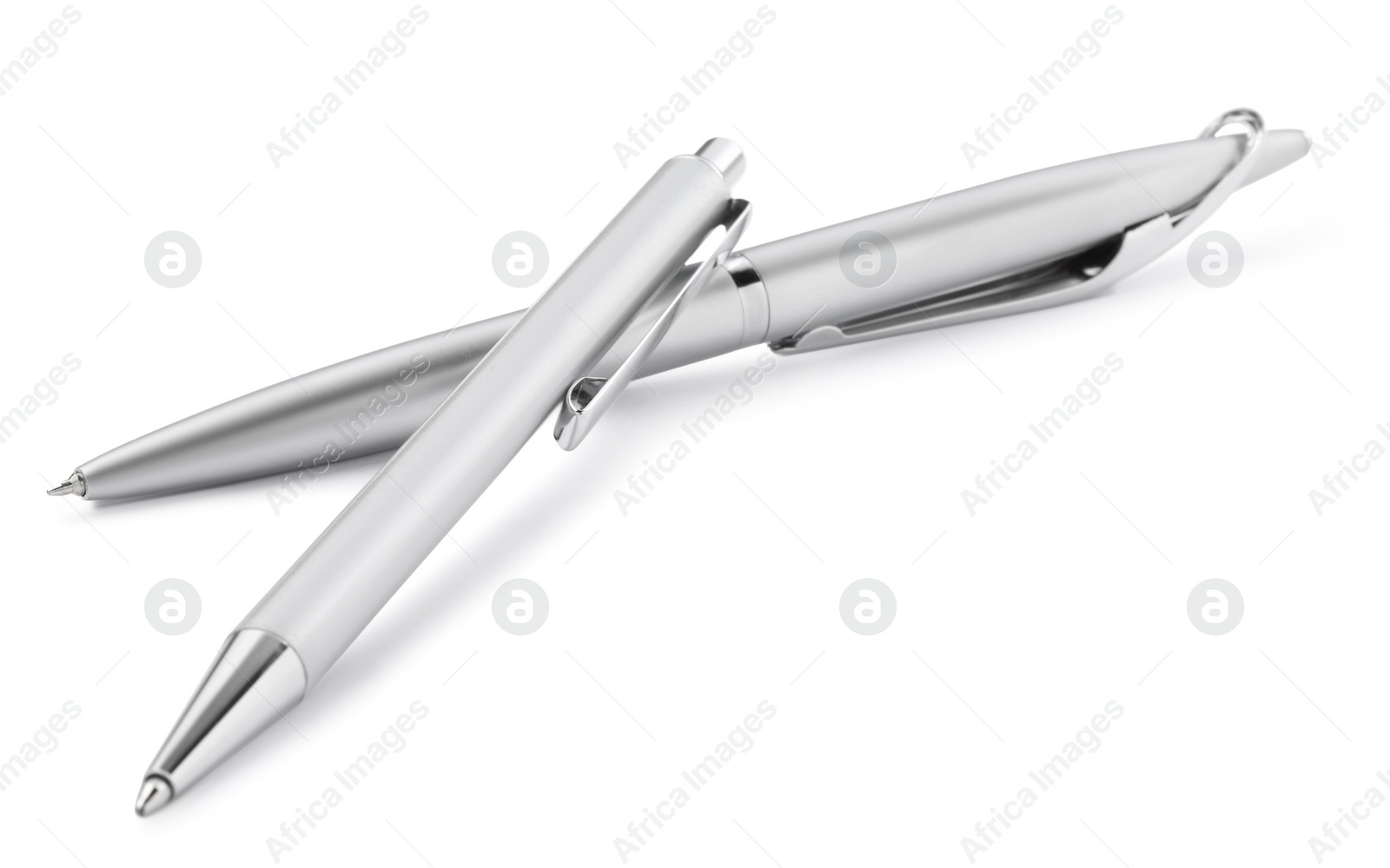 Photo of New stylish silver pens isolated on white