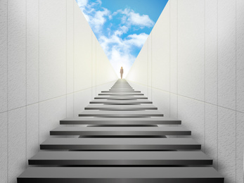 Image of Woman standing on top of stairs and looking forward. Way to success
