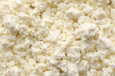 Delicious fresh cottage cheese as background, top view
