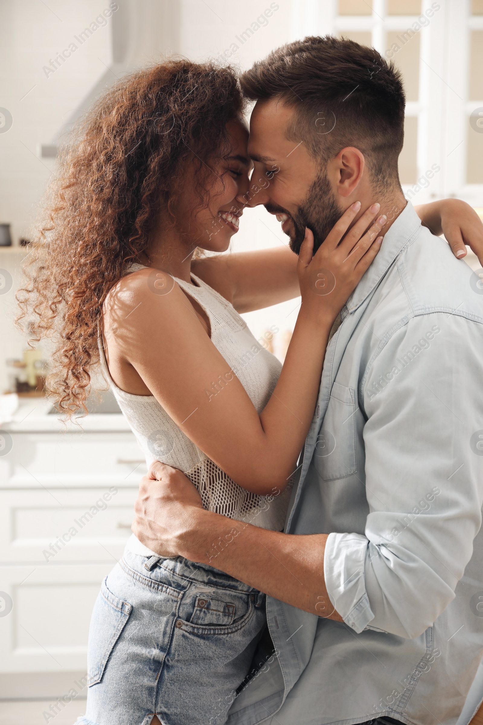 Photo of Lovely couple enjoying time together in kitchen