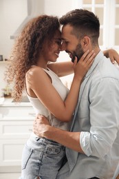 Photo of Lovely couple enjoying time together in kitchen