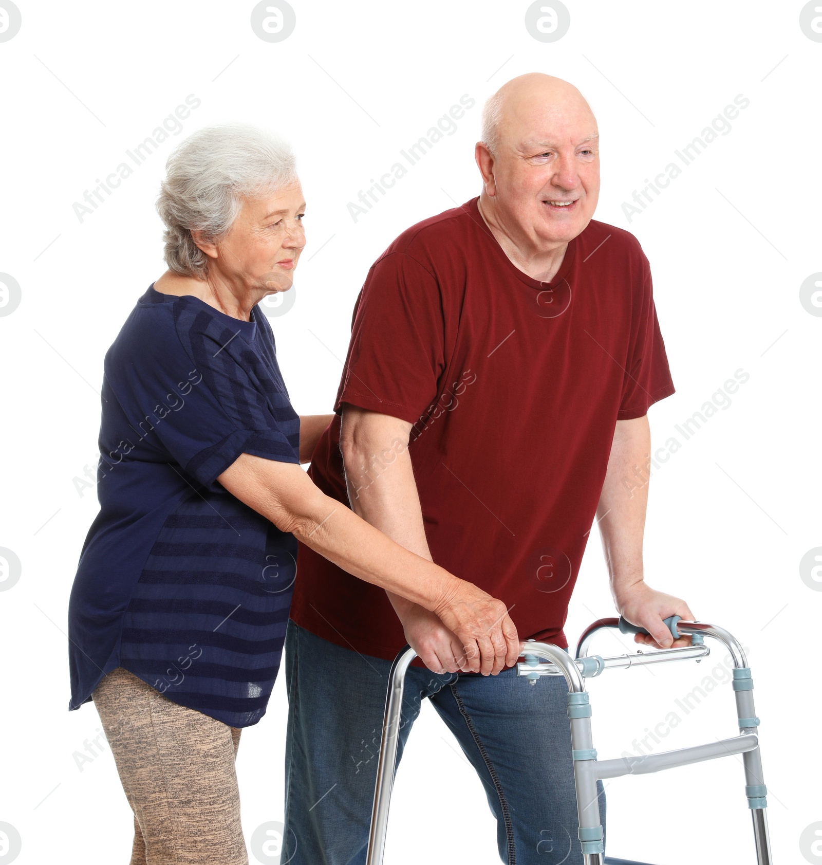 Photo of Elderly woman helping her husband with walking frame on white background