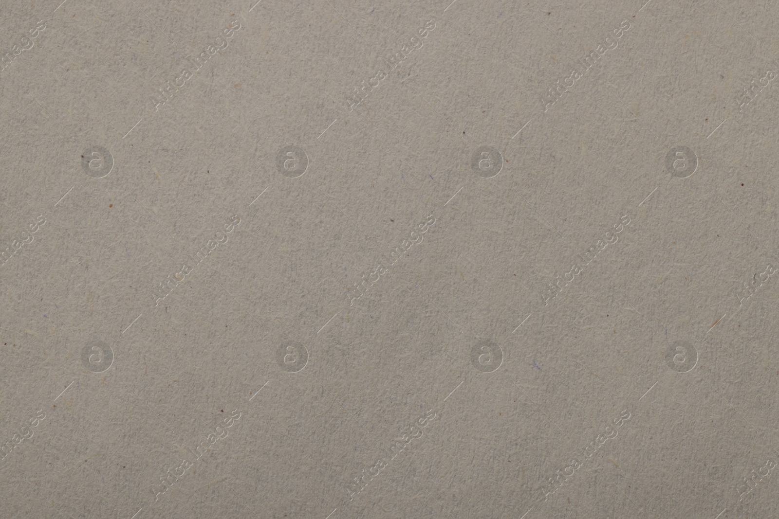 Photo of Texture of light grey paper sheet as background, top view