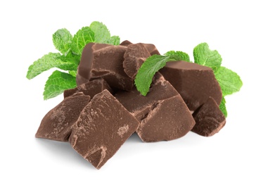 Image of Tasty milk chocolate pieces and mint on white background