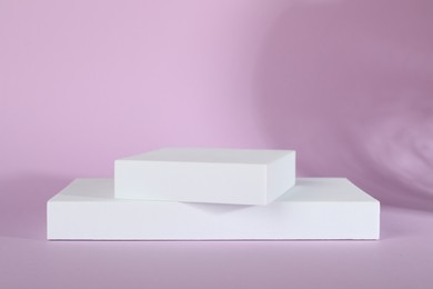 Photo of Presentation of product. White podium on violet background, space for text