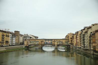 Florence, Italy - February 8, 2024: Picturesque view of city with beautiful buildings and river