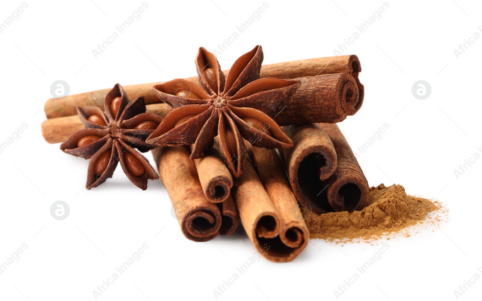 Photo of Dry aromatic cinnamon sticks, powder and anise stars isolated on white