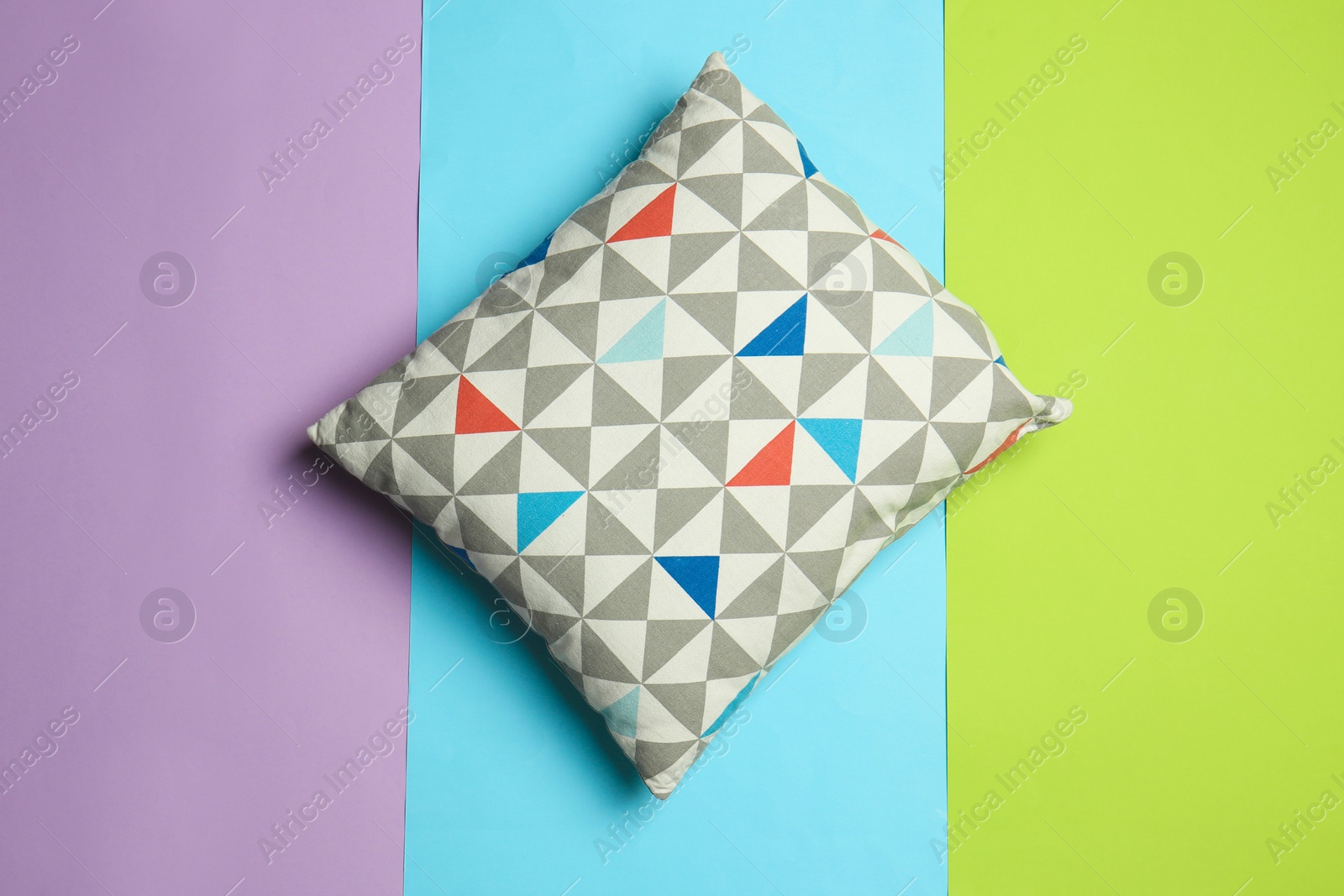 Photo of Soft decorative pillow on color background, top view