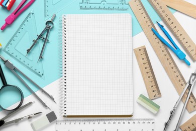 Flat lay composition with different rulers and notebook on color background