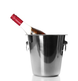 Photo of Bottle of rose champagne in bucket on white background