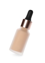 Photo of Bottle of skin foundation isolated on white. Makeup product