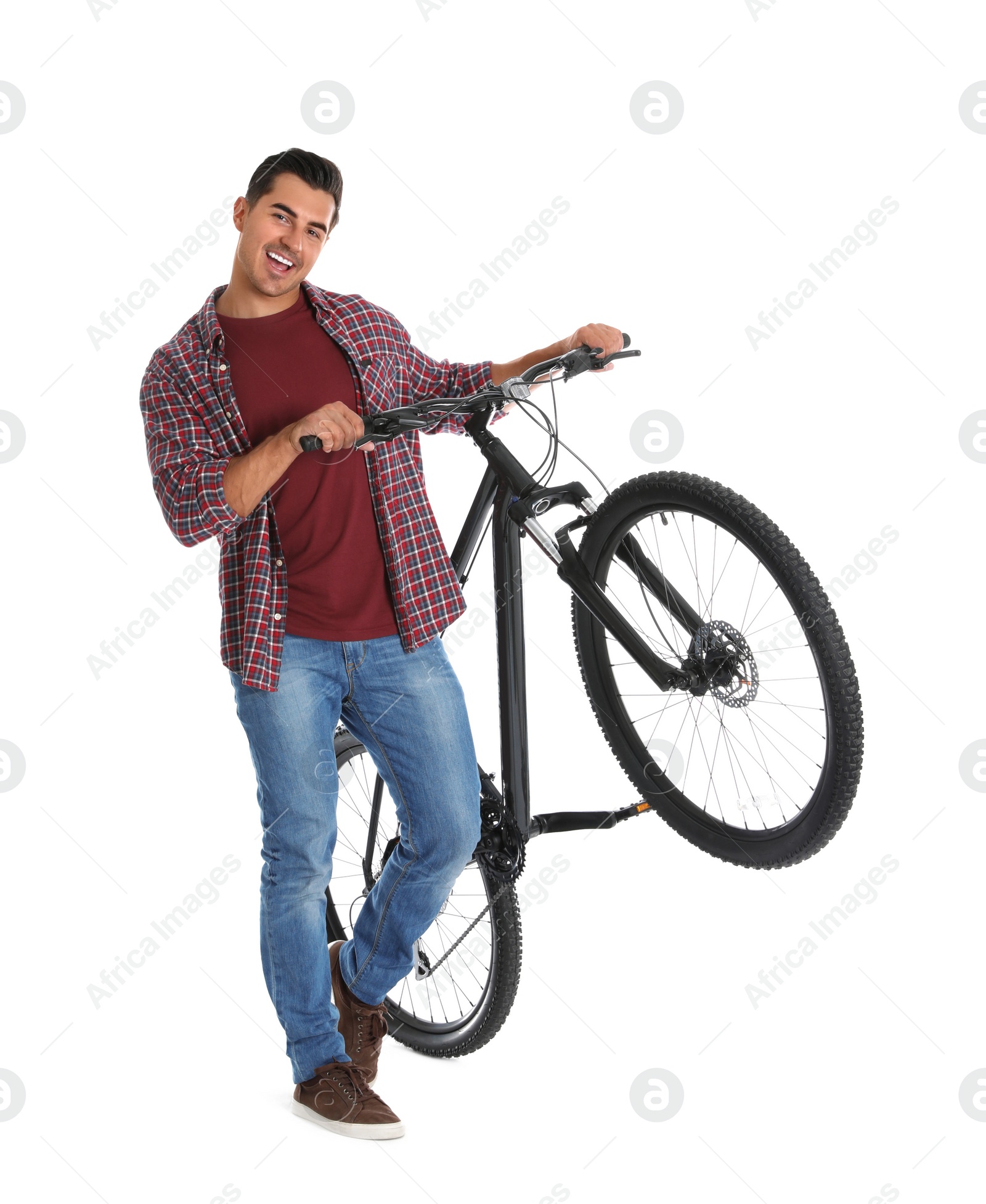 Photo of Handsome young man with modern bicycle on white background