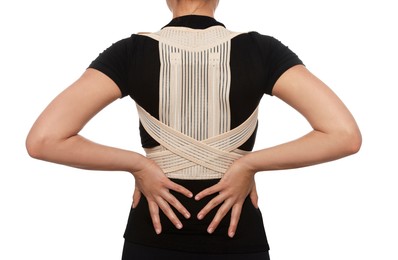 Photo of Closeup of woman with orthopedic corset on white background, back view