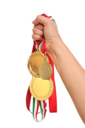 Photo of Woman holding gold medals on white background, closeup