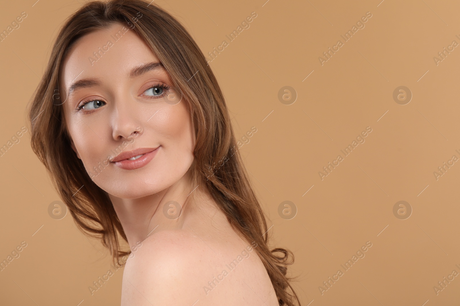 Photo of Beautiful woman with healthy skin on beige background, space for text