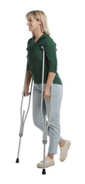 Full length portrait of woman with crutches on white background