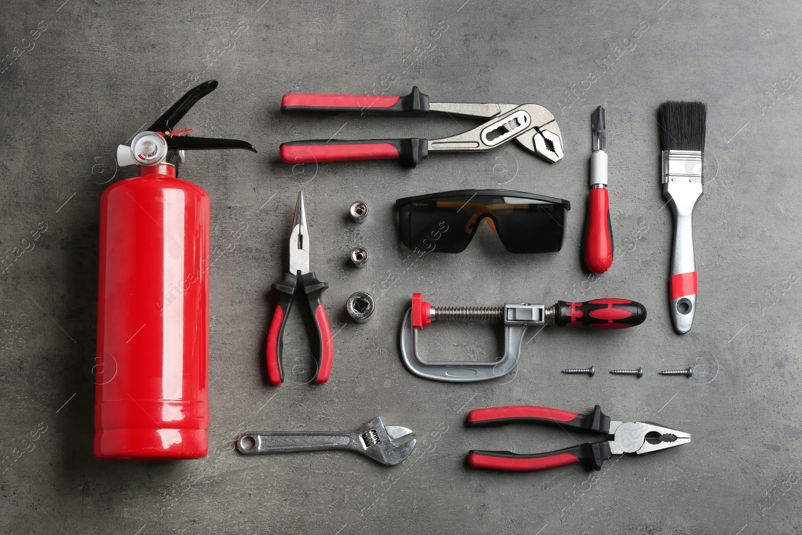 Photo of Flat lay composition with different construction tools on grey background