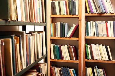 Image of Collection of different books on shelves in library