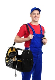 Photo of Young plumber with tool bag on white background