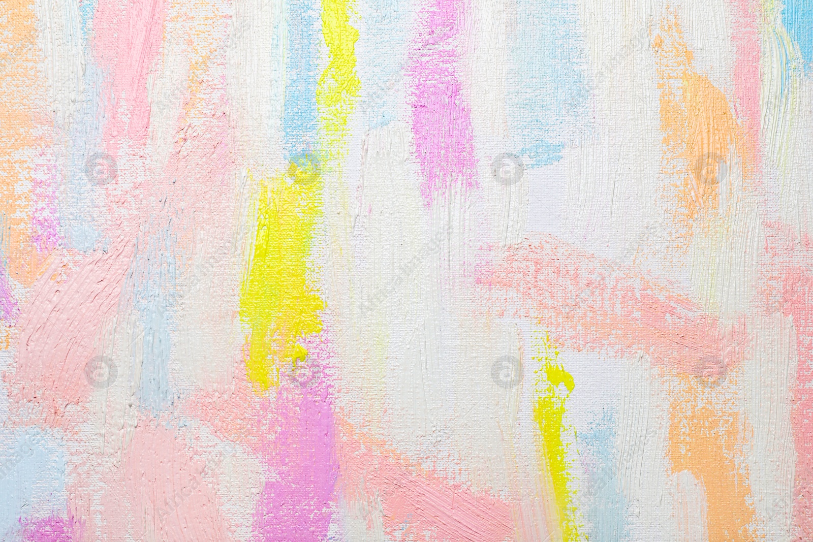 Photo of Strokes of different pastel acrylic paints on white canvas, closeup