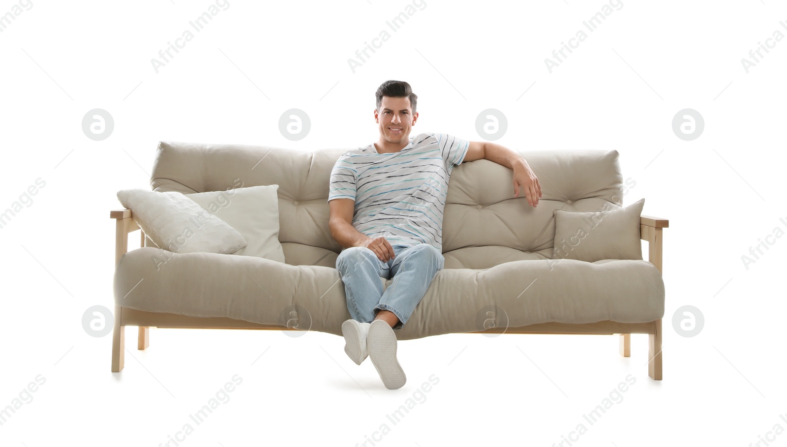 Photo of Man relaxing on comfortable sofa against white background