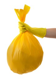 Photo of Woman holding plastic bag full of garbage on white background, closeup