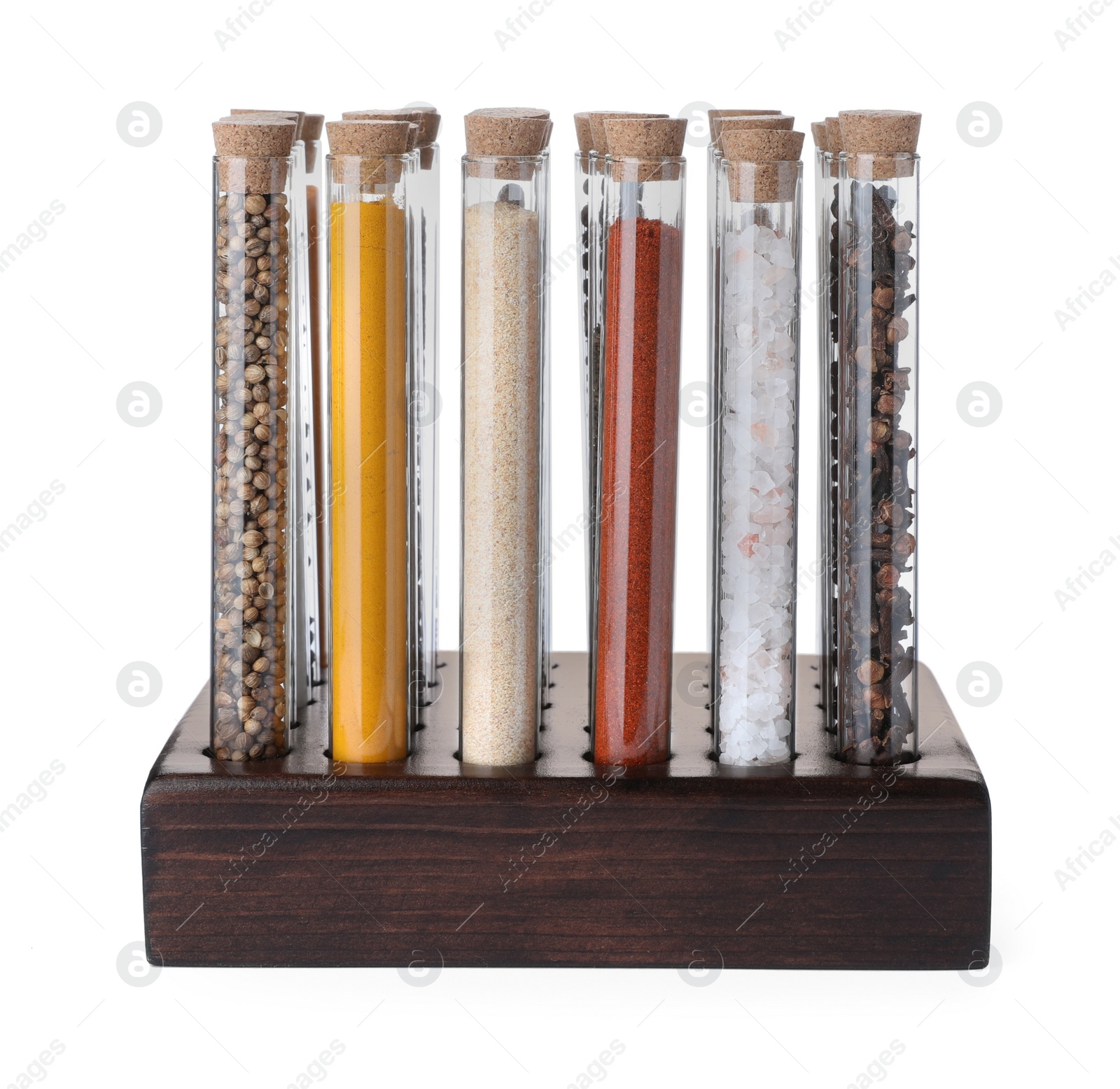 Photo of Glass tubes with different spices in rack on white background