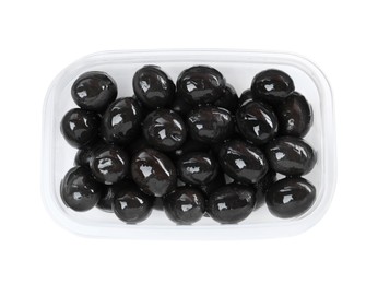 Photo of Fresh black olives in plastic container isolated on white, top view