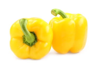 Photo of Ripe yellow bell peppers isolated on white