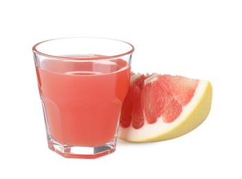 Glass of pink pomelo juice and fruit isolated on white