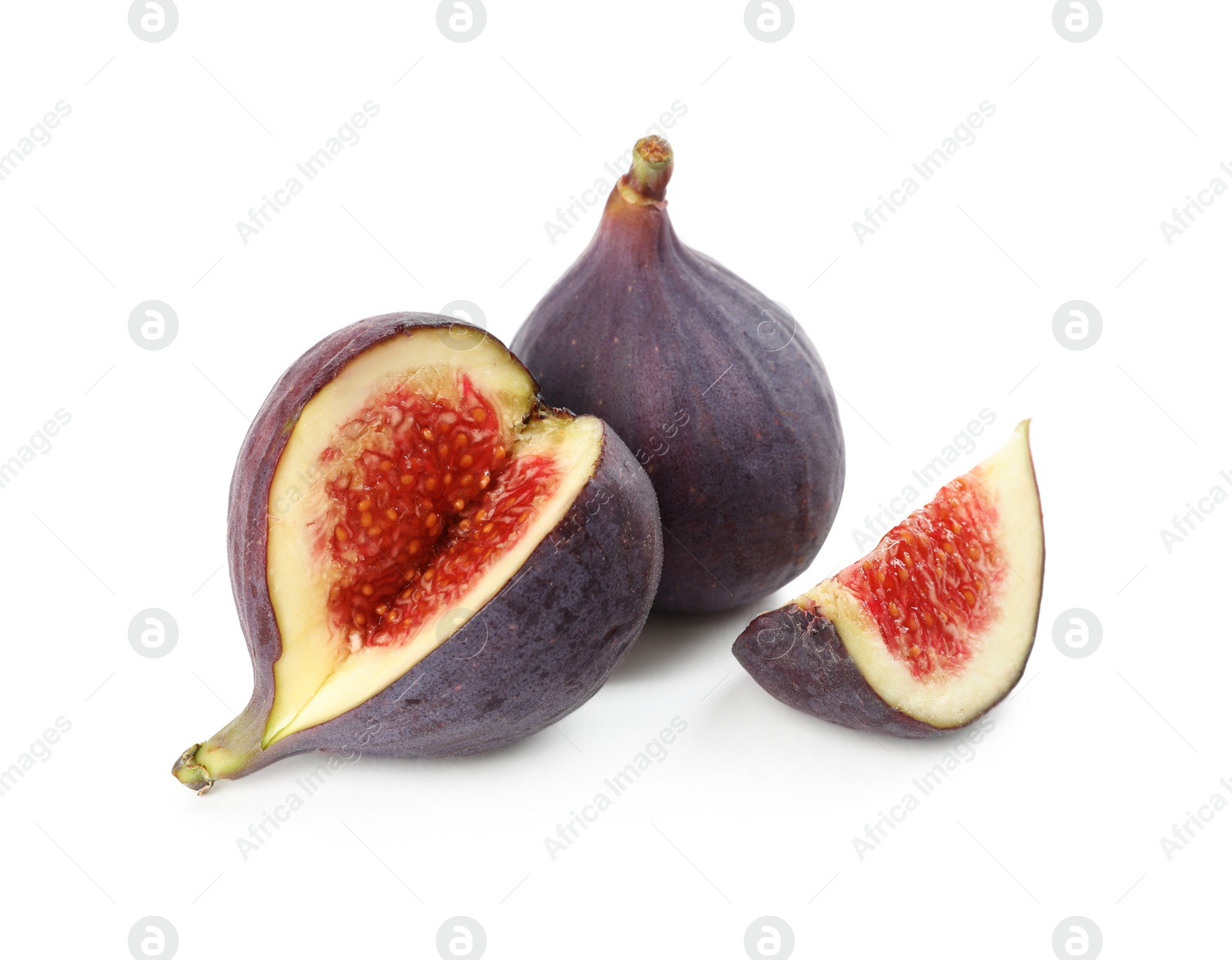 Photo of Whole and cut tasty fresh figs isolated on white