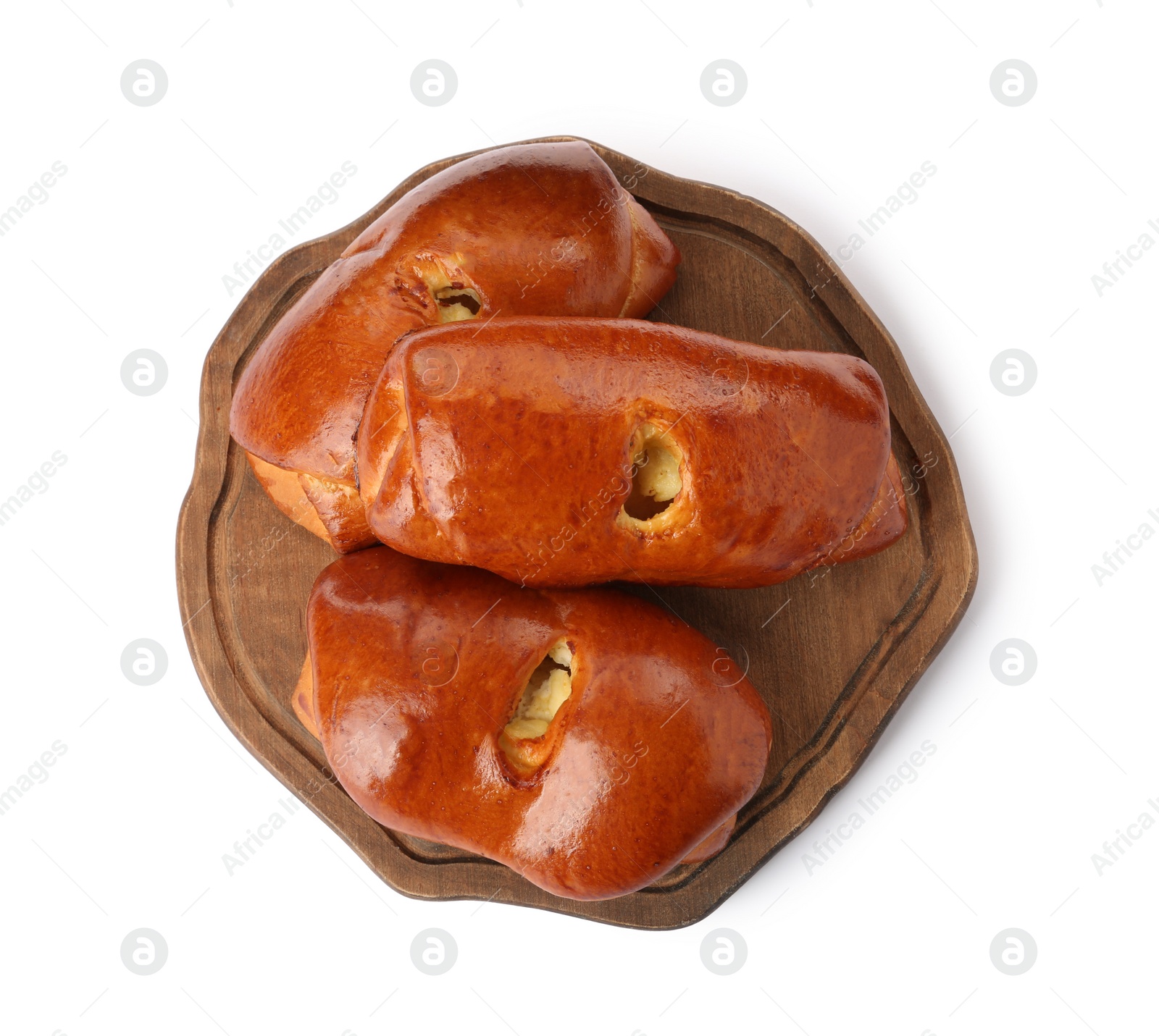 Photo of Wooden board with delicious baked patties on white background, top view