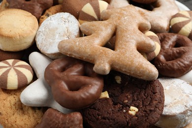 Photo of Different delicious cookies as background, closeup view
