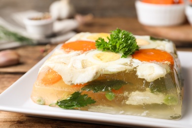 Delicious fish aspic with parsley on plate, closeup