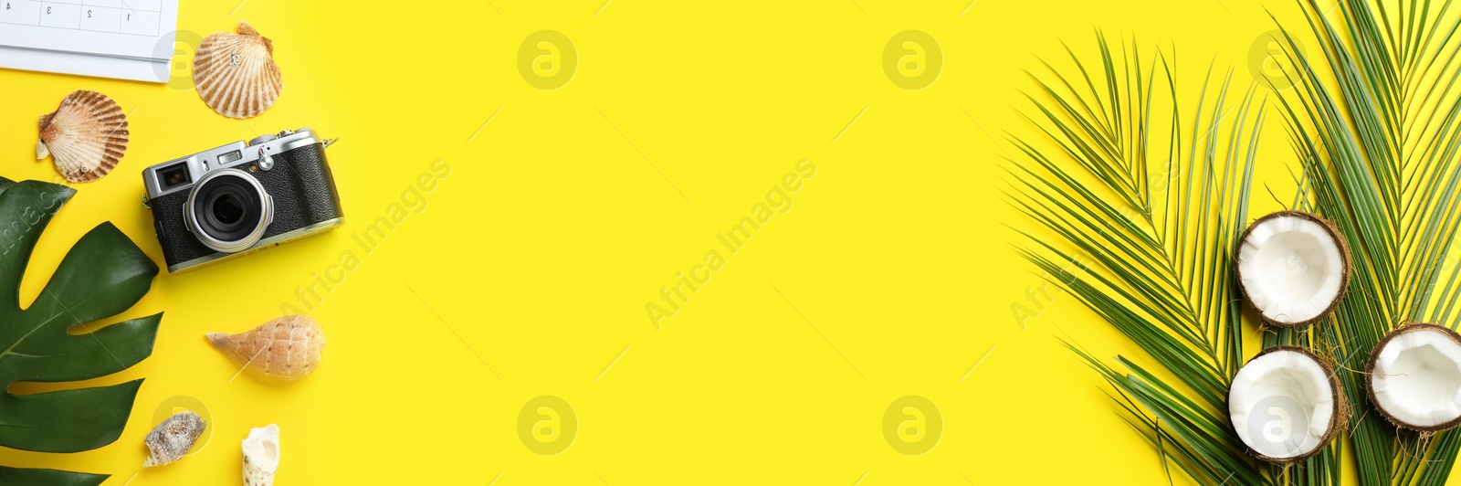 Image of Flat lay composition with vacation accessories on yellow background, space for text. Banner design