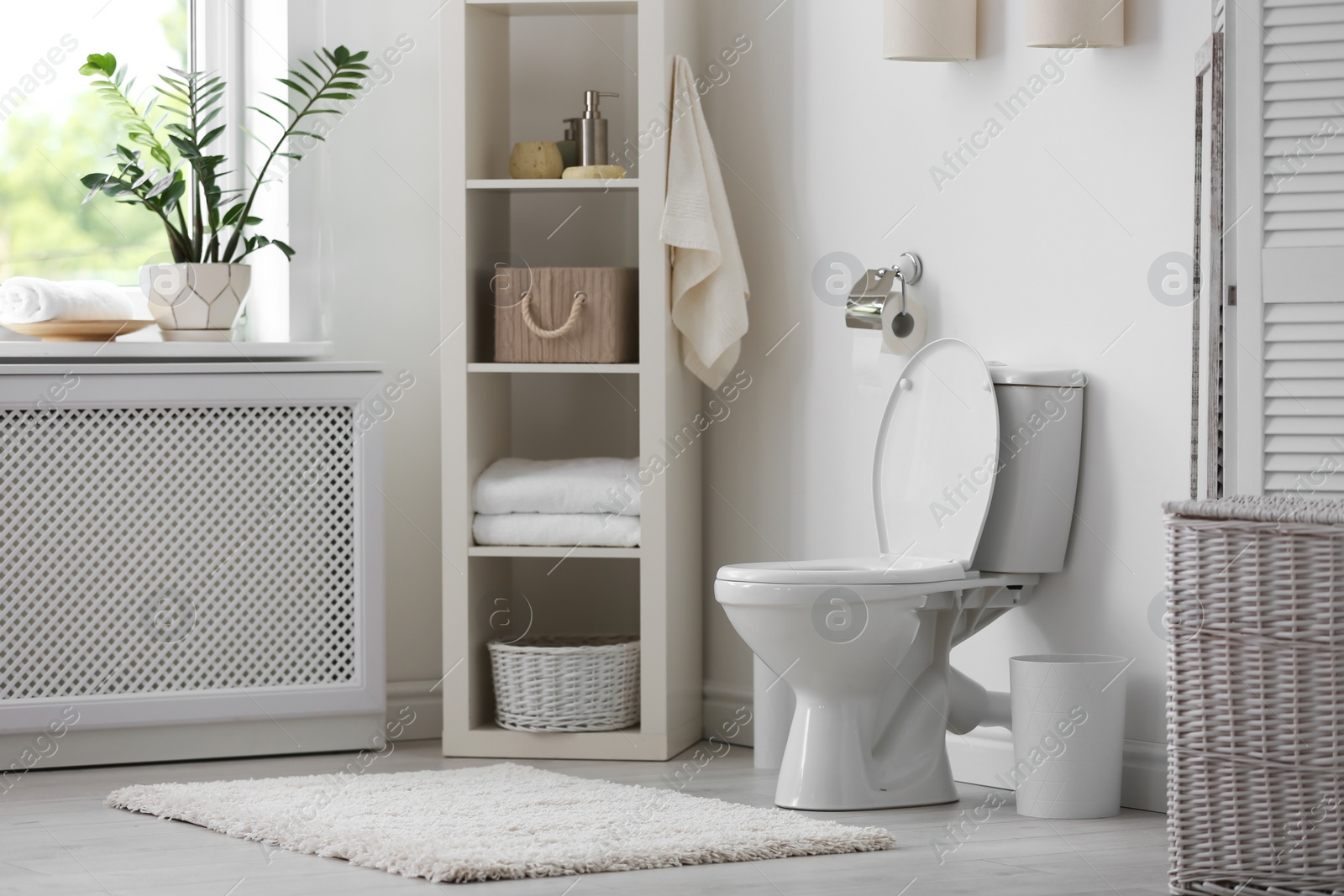 Photo of Toilet bowl in modern bathroom interior