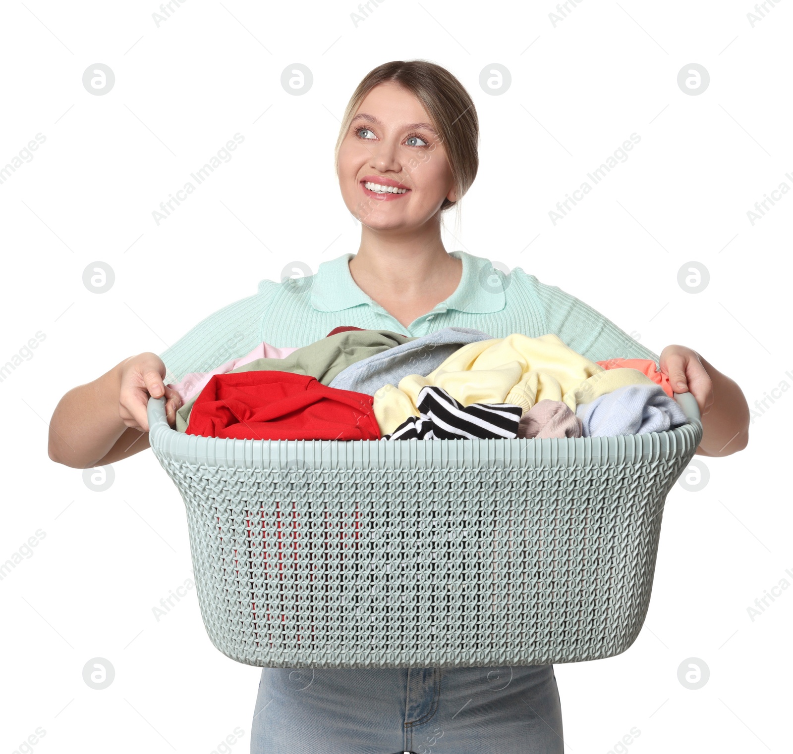 Photo of Happy woman with basket full of laundry on white background