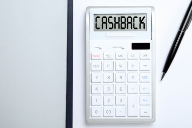 Image of Calculator with word Cashback and pen on white background, top view. Space for text