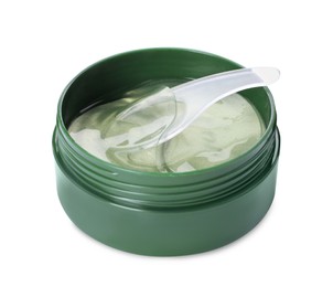 Photo of Under eye patches in jar with spatula isolated on white. Cosmetic product