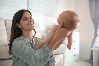 Mother with her newborn baby at home